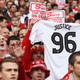 A Liverpool supporter holds up a ‘Justice for the 96' jersey at a 2012 FA Cup match. (Photo credit: Scott Heavy/Getty)